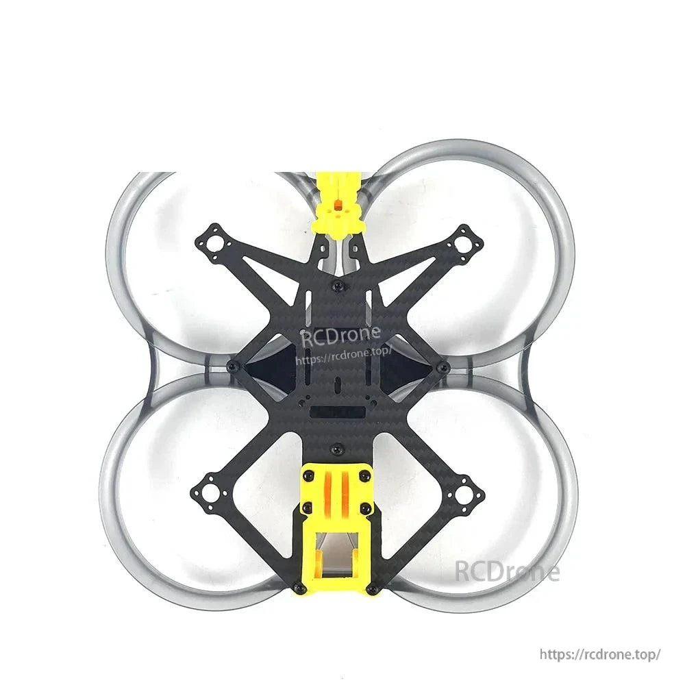 Top-down view of frame with carbon center plate and four circular duct guards, yellow mount installed