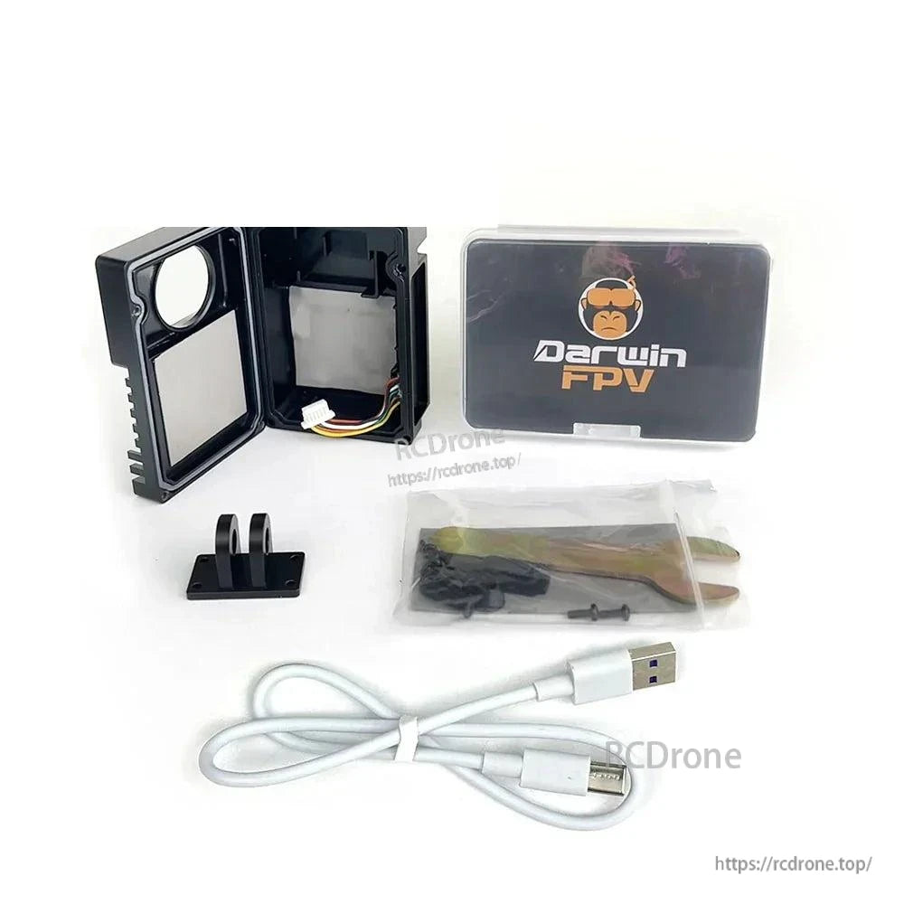 Kit contents laid out: opened case shell, mount adapter, screws, USB cable, tool and DarwinFPV box