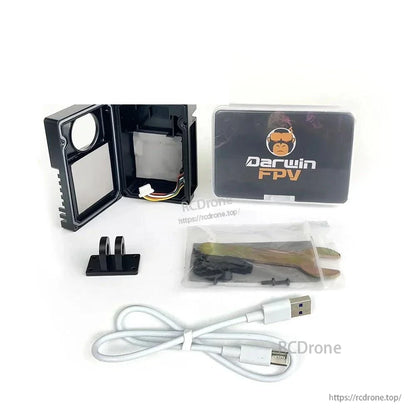 Kit contents laid out: opened case shell, mount adapter, screws, USB cable, tool and DarwinFPV box