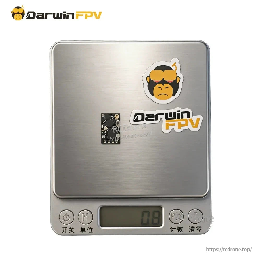 Nano receiver board shown on a digital scale for size and weight reference