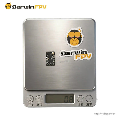 Nano receiver board shown on a digital scale for size and weight reference