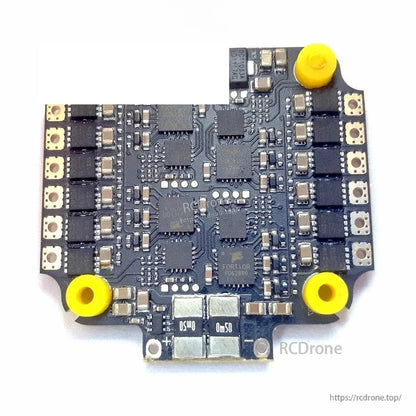 ESC top view showing power components, solder pad rows, and stacked board connector area