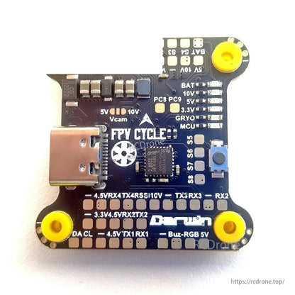 Flight controller underside with USB port and labeled solder pads for BAT, 5V, Vcam, RX/TX