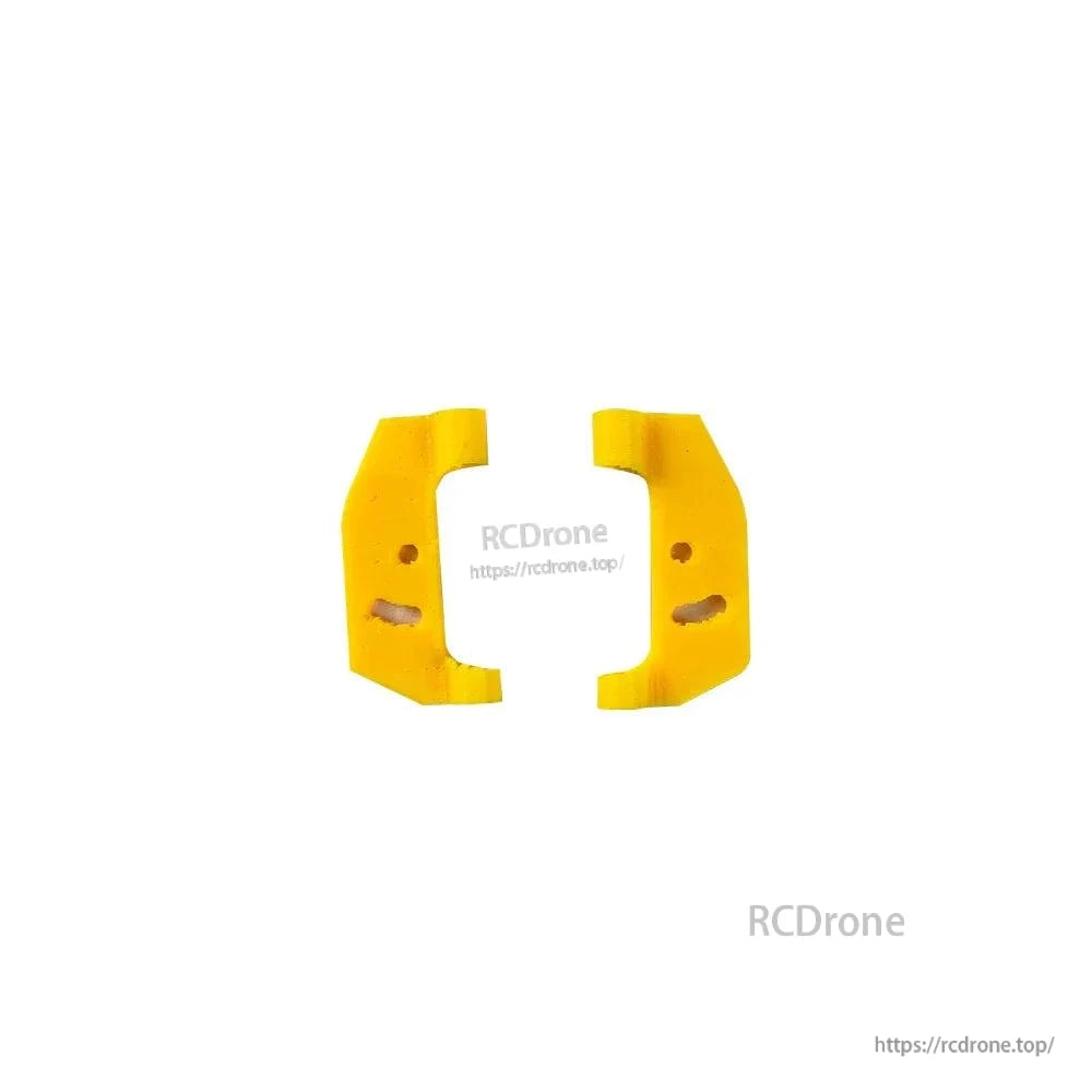 Pair of yellow TPU side bumpers/mounts for FoldApe4 frame, inner slot detail visible