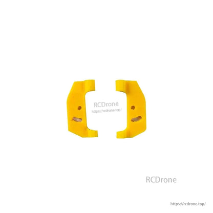 Pair of yellow TPU side bumpers/mounts for FoldApe4 frame, inner slot detail visible