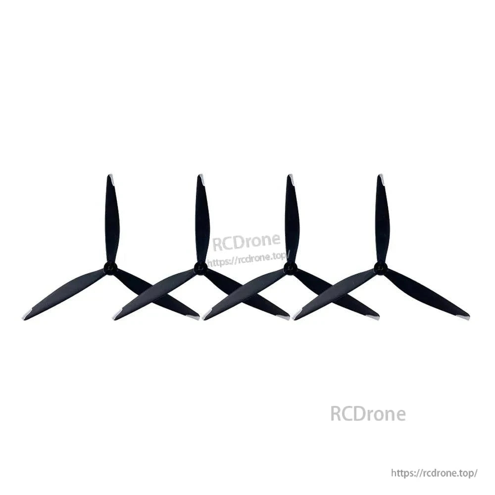Row of four tri-blade propellers shown at an angle to highlight blade profile and hubs