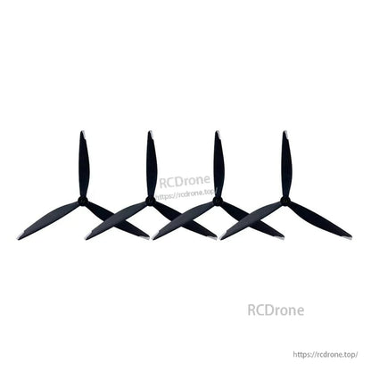 Row of four tri-blade propellers shown at an angle to highlight blade profile and hubs