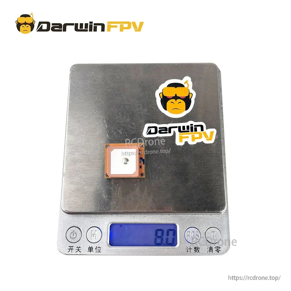 DarwinFPV GM8 GPS module on digital scale showing 8.0 g weight