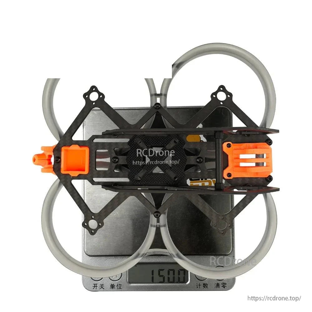 Assembled frame on digital scale showing 150.0 g weight reading, top view