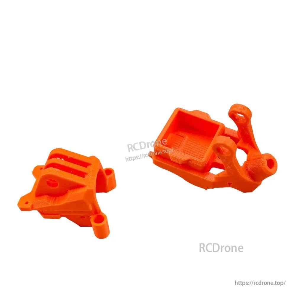 Two orange TPU printed mounts shown together, camera mount and rear mount pieces