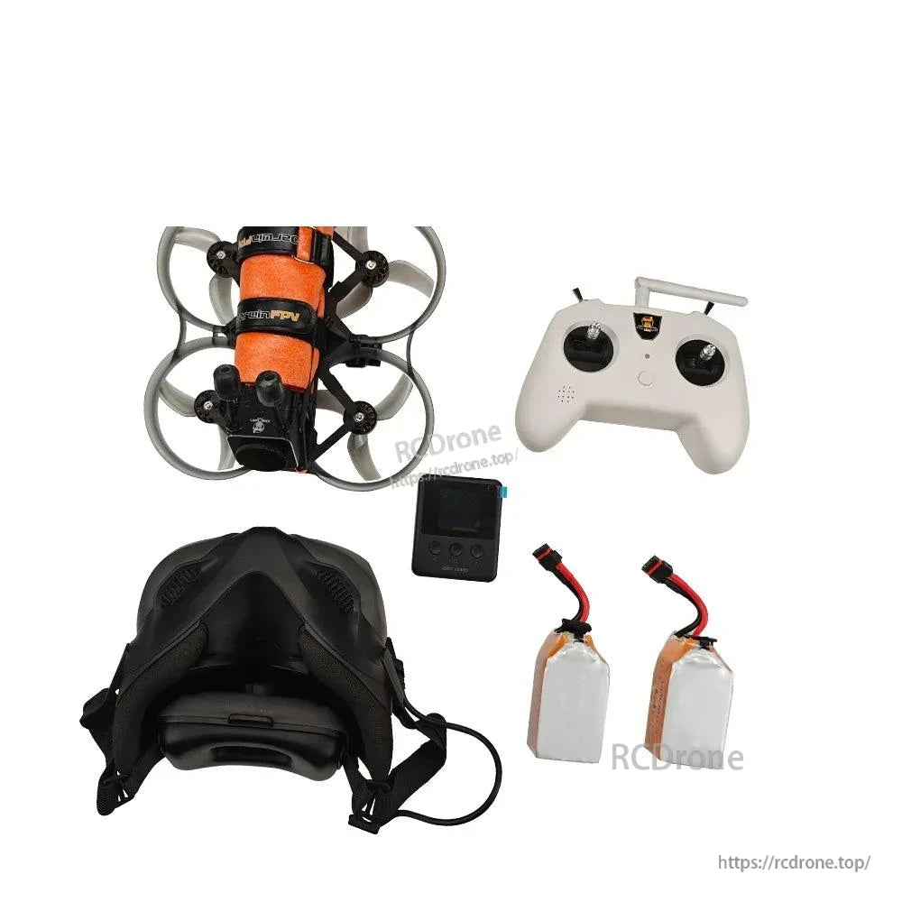 FPV drone kit contents: ducted quadcopter, radio controller, FPV goggles, small charger unit and 2 batteries