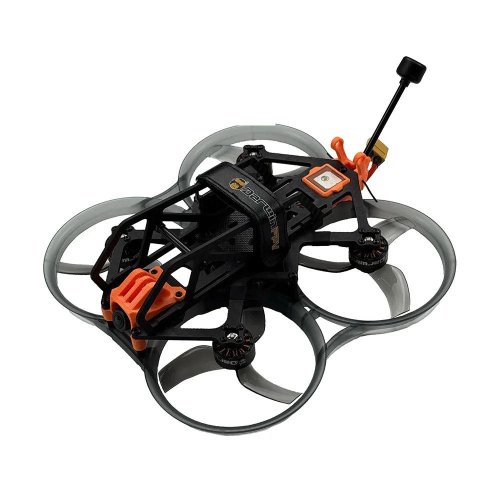 DarwinFPV ducted FPV drone with orange camera mount and prop guards, angled top view