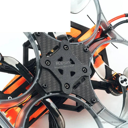 Bottom plate close-up showing carbon fiber frame reinforcement, screws, and duct attachment points