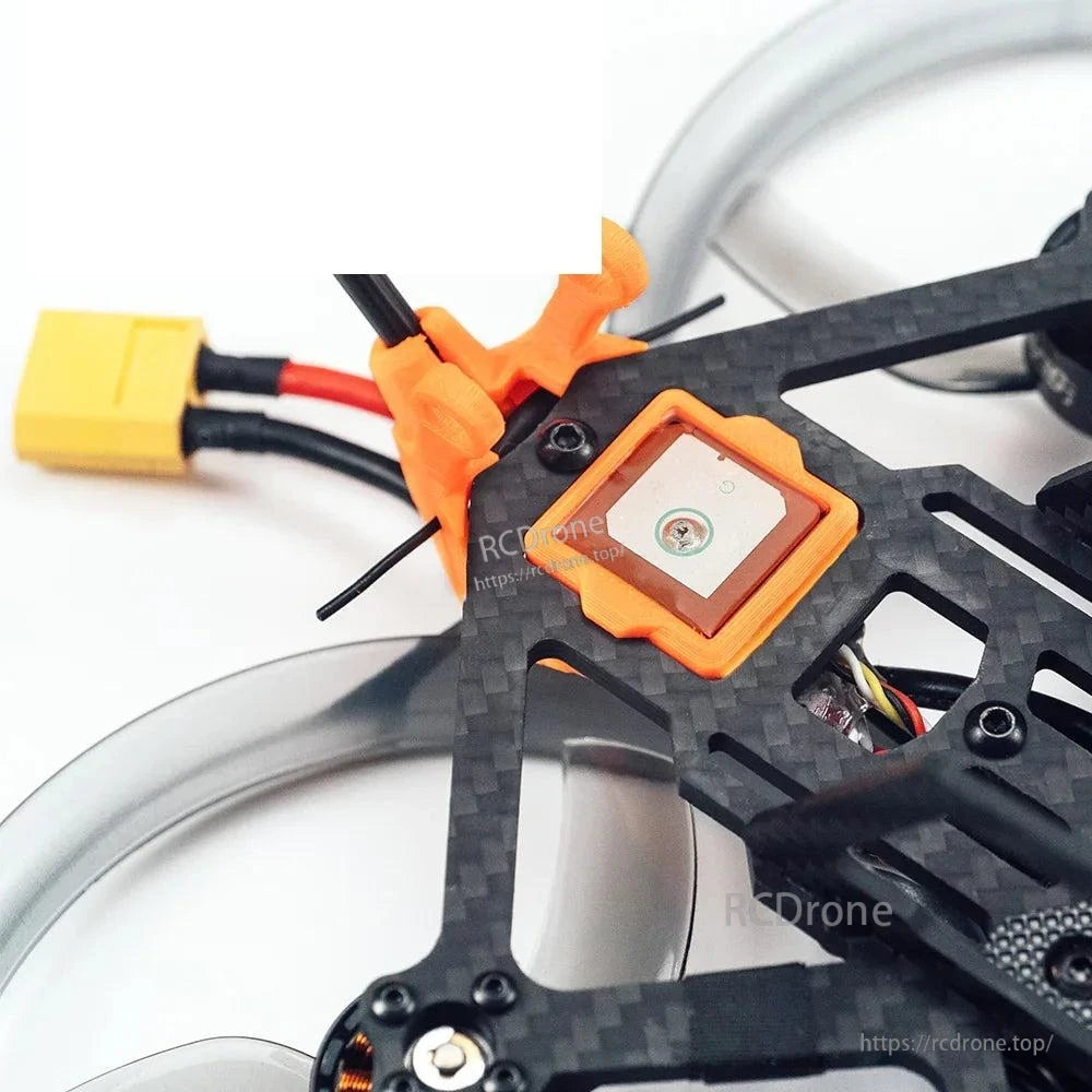 Top module close-up with square unit in orange mount and XT-style battery connector lead
