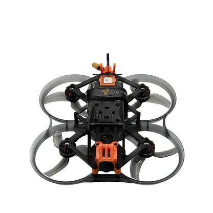 Top-down view of ducted FPV quad showing four prop guards, center frame, and front camera mount