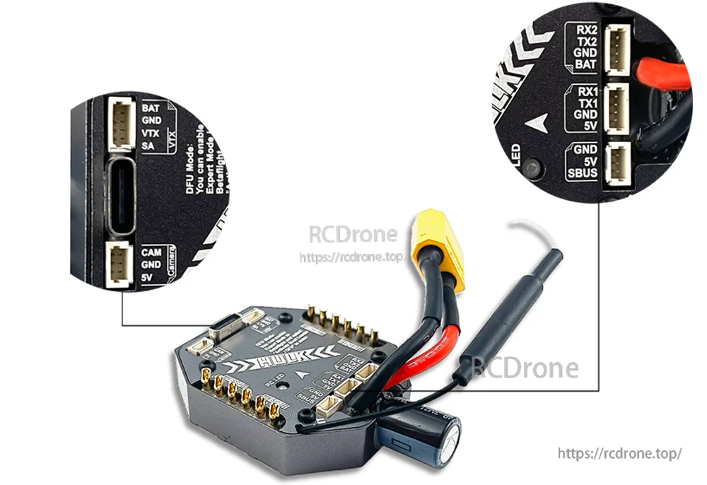 F411 AIO flight controller and wiring close-up with labeled ports for VTX, camera, UART, SBUS, and USB-C