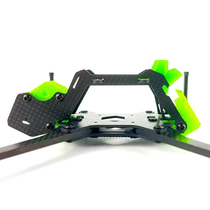 Front low-angle view of carbon fiber FPV frame with quick-release TPU mount and standoffs
