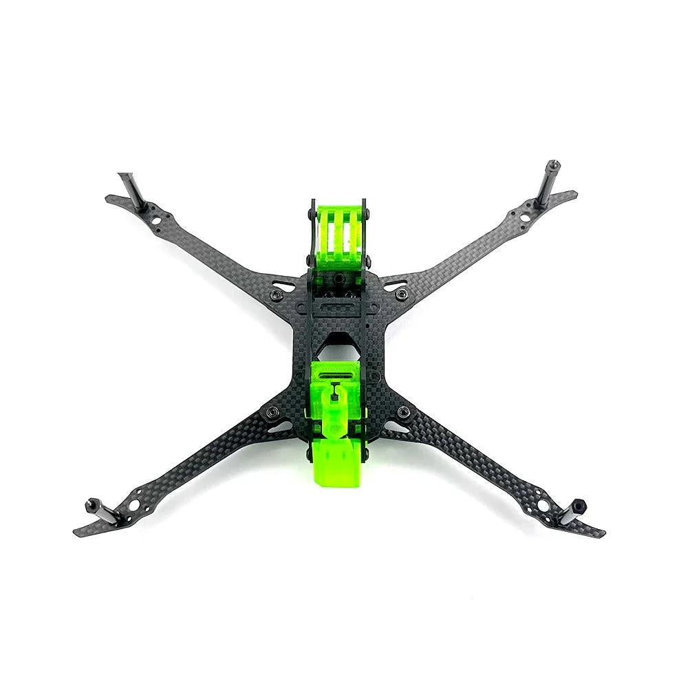 Top-down view of 220mm wheelbase carbon fiber frame with X-arm layout and green TPU mounts