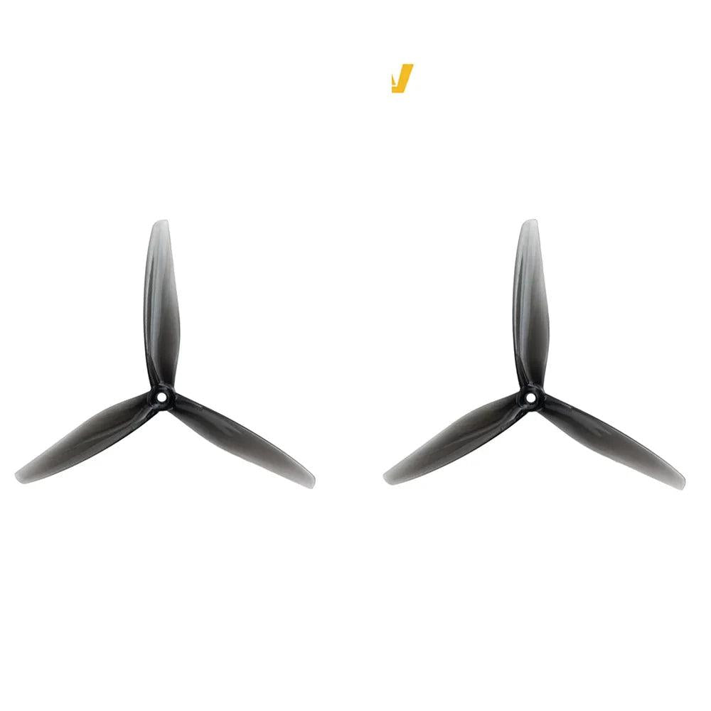 Pair of clear gray tri-blade drone propellers with 5mm center hole, Hurricane 7050-3 style