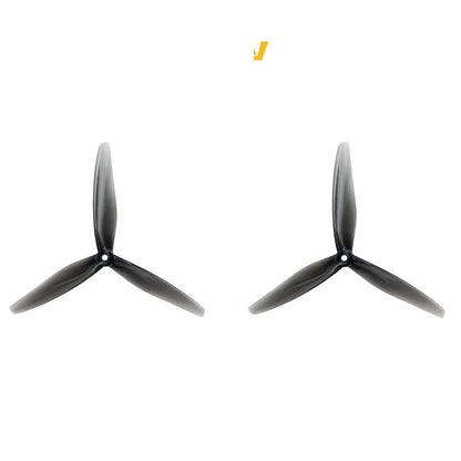 Pair of clear gray tri-blade drone propellers with 5mm center hole, Hurricane 7050-3 style