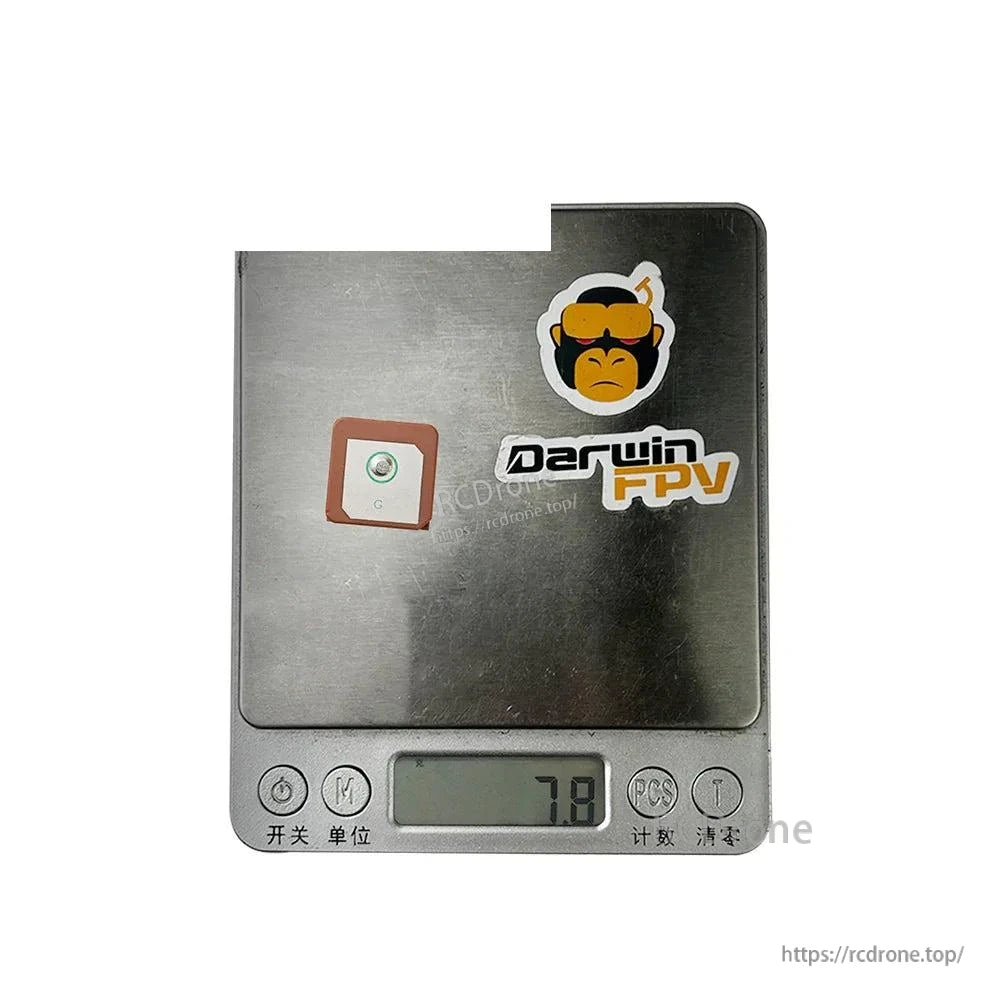 GPS antenna shown on digital scale displaying 7.8 g weight