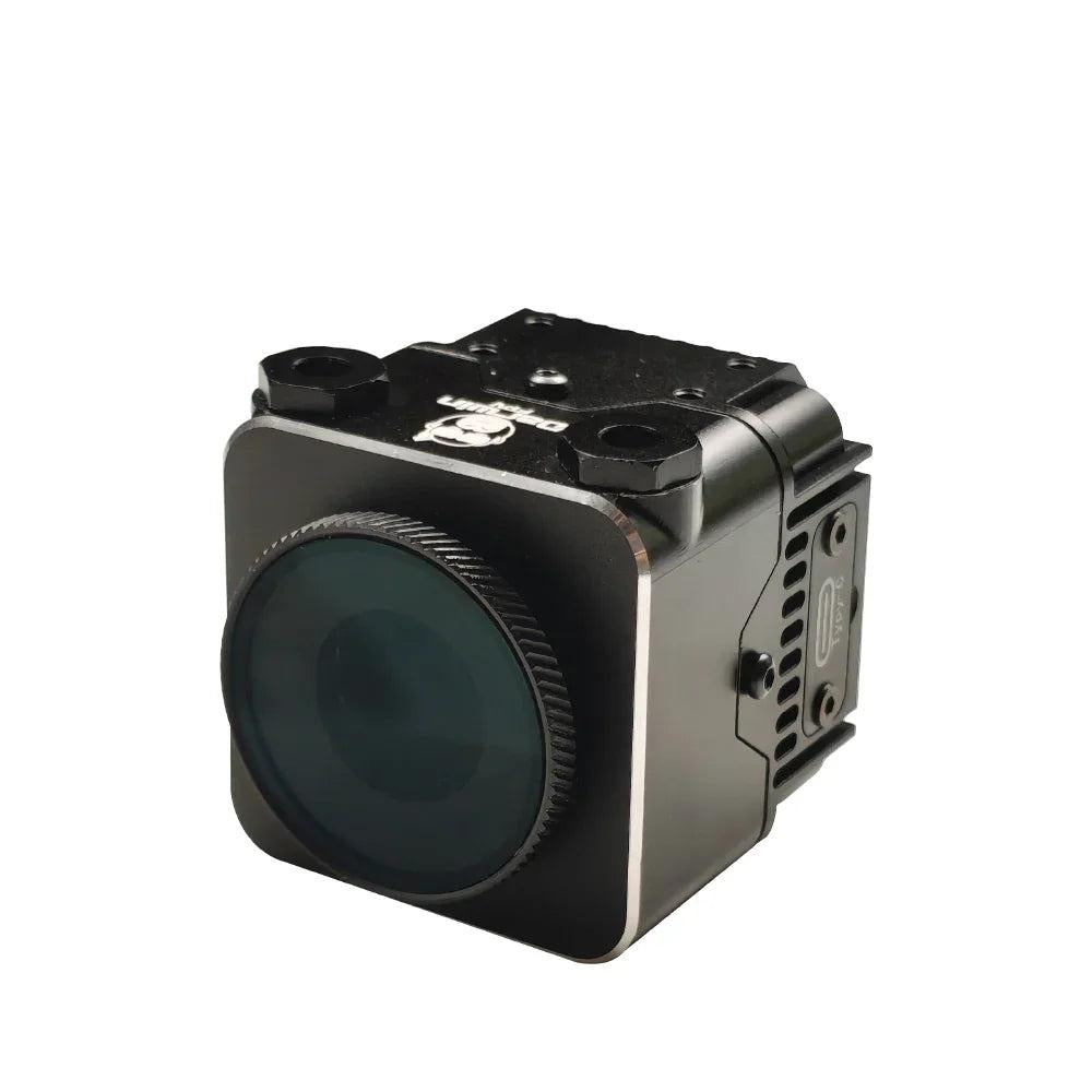 Front-left view of CNC aluminum housing with large round lens cover and top mounting holes