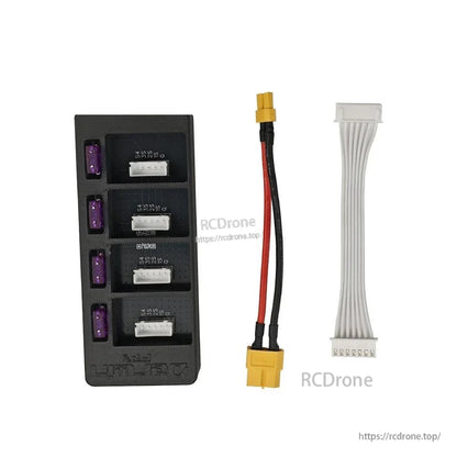 Rear-side view of board with four purple blade fuses, plus included XT60 lead and balance cable