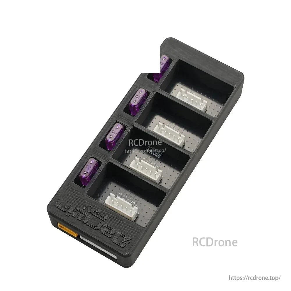 Angled view of charger board bays with balance connectors installed and purple fuses along the edge