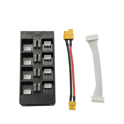 Package contents: parallel charger board, XT60 power lead, and white multi-pin balance extension cable