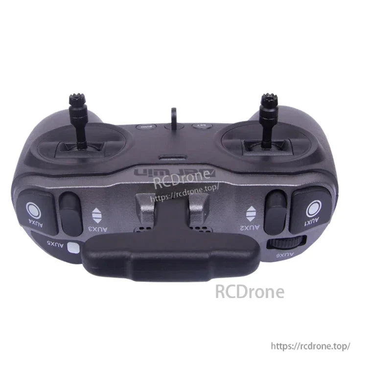 Top edge view of TX-Lite transmitter showing AUX switches, shoulder buttons, and antenna mount