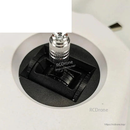 Gimbal stick close-up on TX8 transmitter showing textured metal thumb stick and stick travel