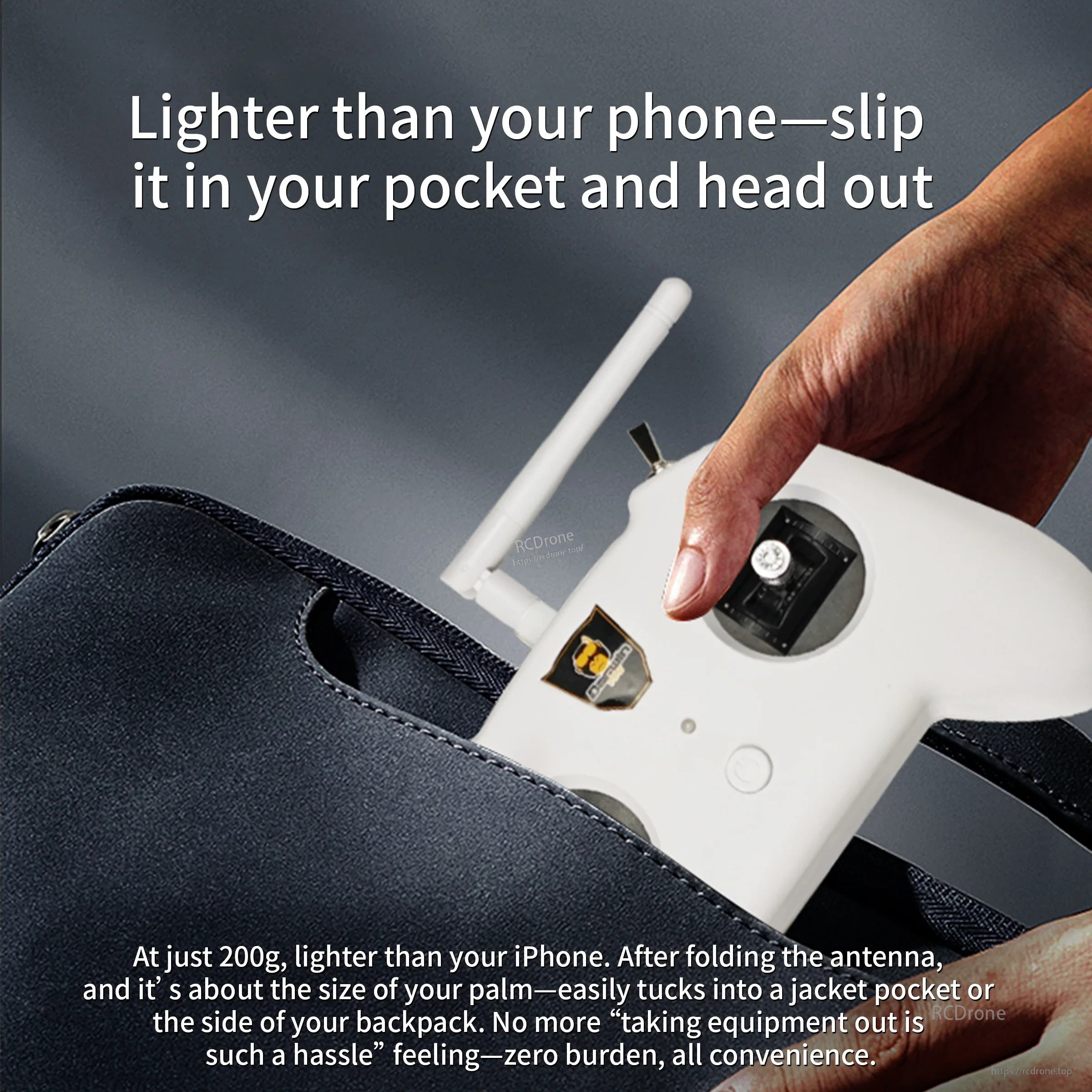 Pocketable DarwinFPV TX8 controller held above a bag, highlighting lightweight portable design and foldable antenna