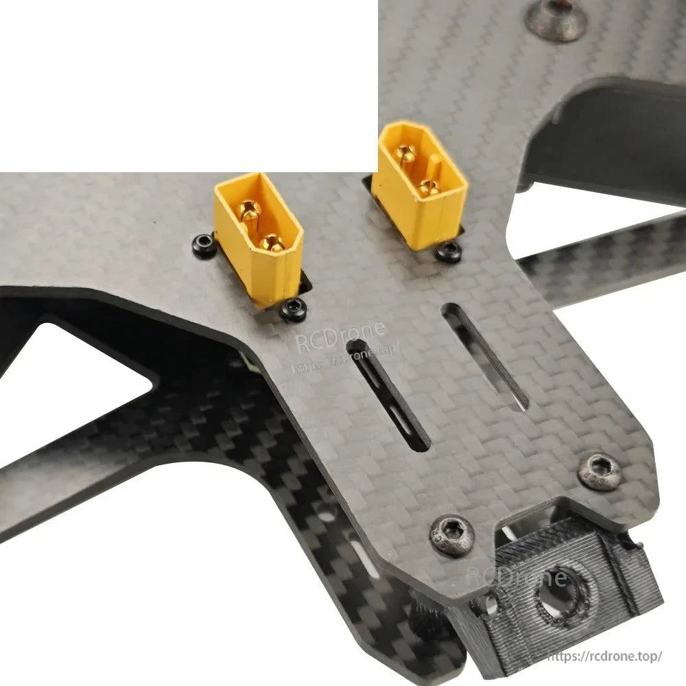 XT60 power connector mounts on carbon fiber plate, dual yellow XT60 sockets close-up