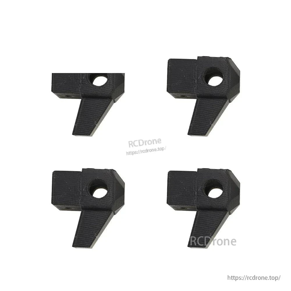 Four black arm clamp blocks with center bolt hole for tube arm mounting
