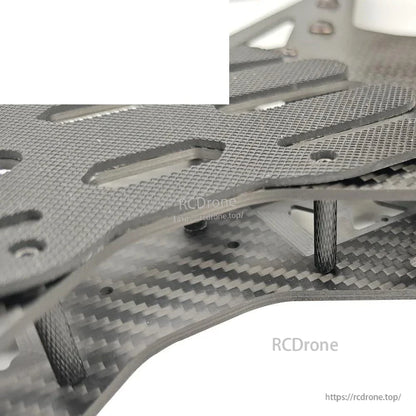 Close-up of carbon fiber frame standoffs and plate spacing on Toruk15 15-inch FPV drone frame
