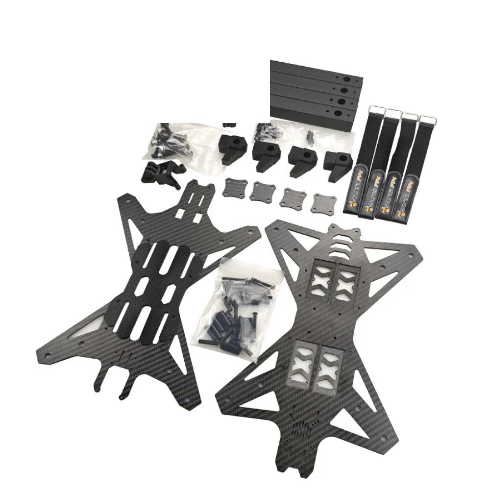 Toruk15 frame kit contents with carbon fiber plates, carbon tube arms, straps, hardware, and mounts