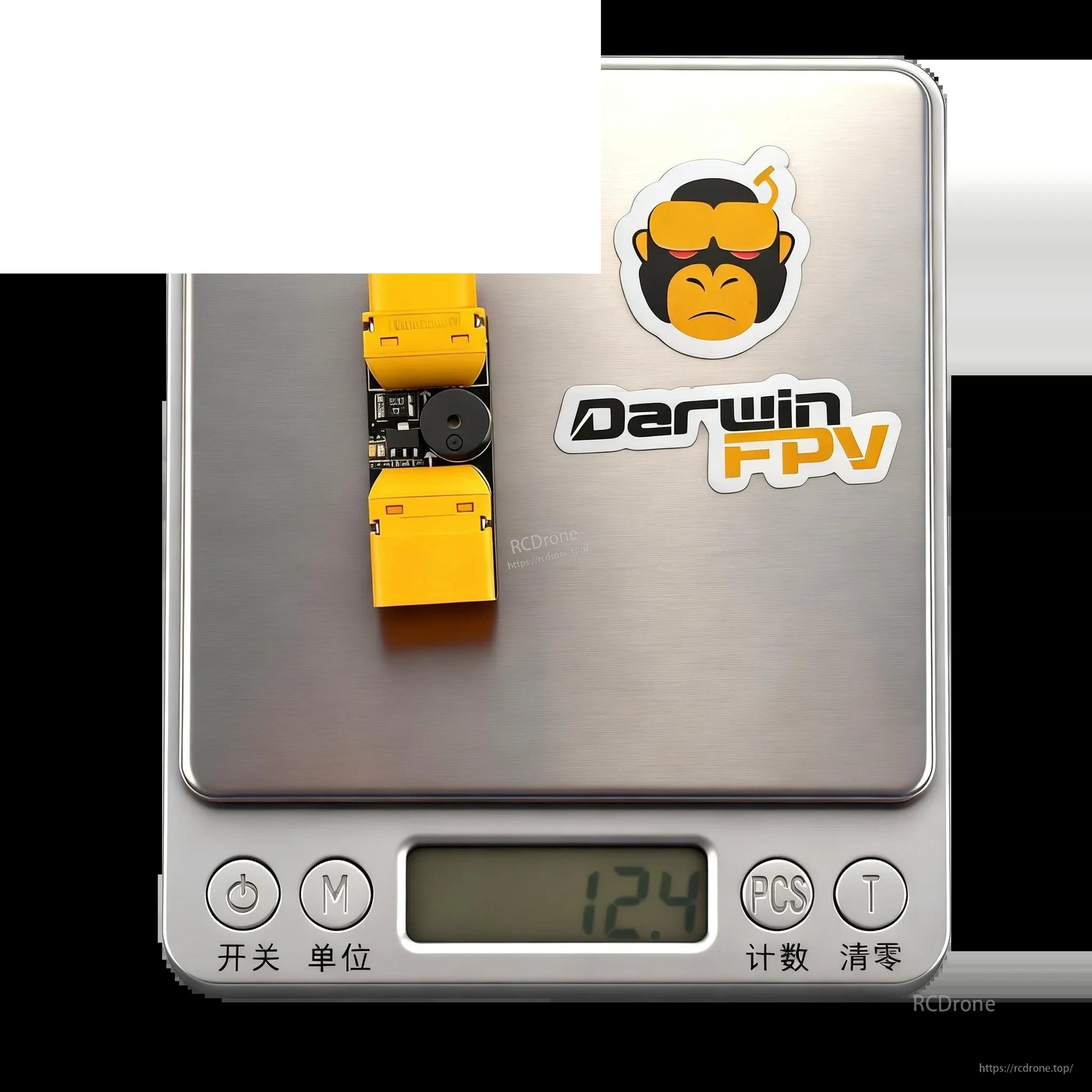 Device on digital scale showing 12.4 g weight next to DarwinFPV logo sticker