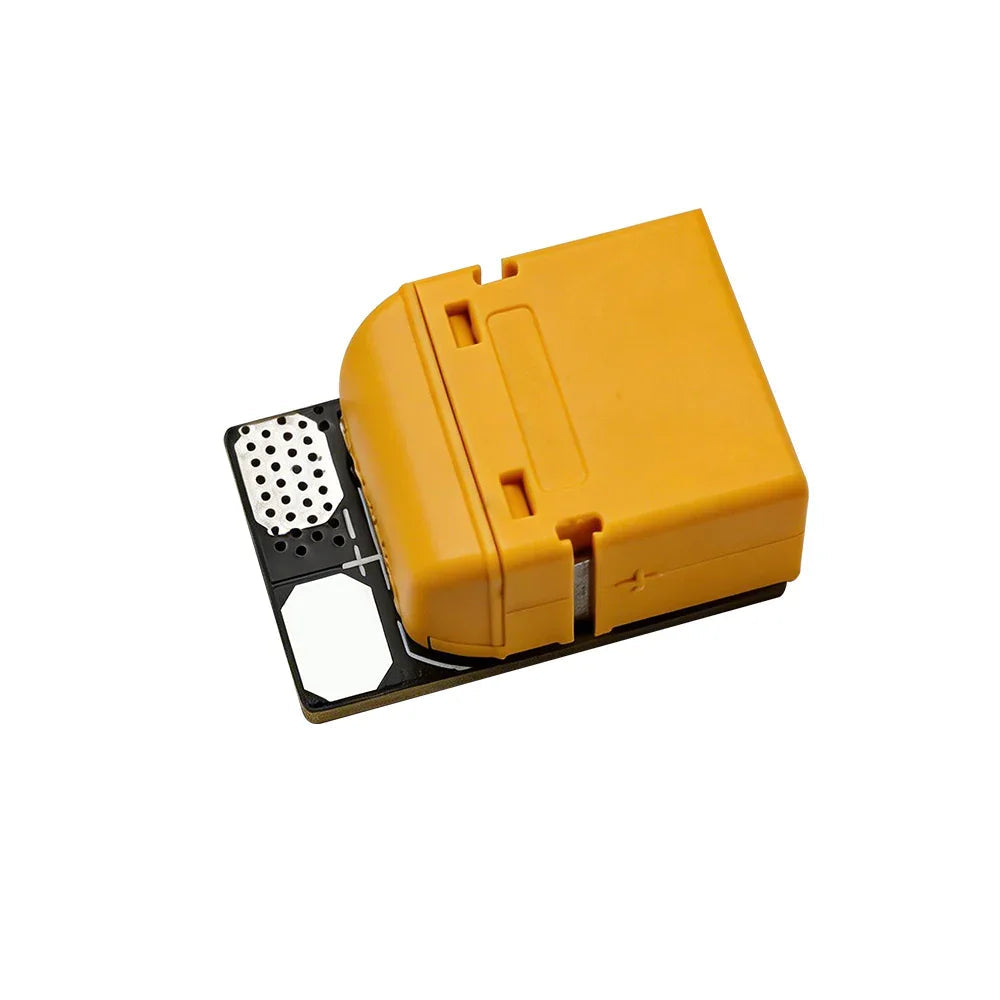 Angled view of yellow XT60 anti-spark filter board with exposed metal pads and polarity marks