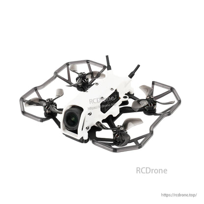 FPV quadcopter with installed prop guards, showing duct-style bumper frame around the 2-inch propellers