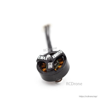 EMAX 0802 15500KV brushless motor angled top view with exposed copper windings and single lead cable