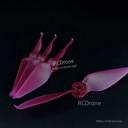 Purple translucent 2-blade FPV racing propeller set, four stacked props plus one single display