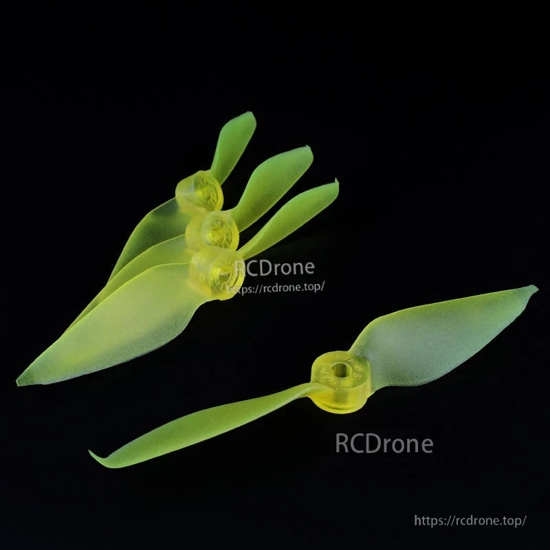Neon yellow translucent 2-blade FPV racing propeller set, four stacked props plus one single