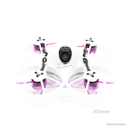 Purple 4-blade propellers installed on a micro whoop FPV drone, top view with camera