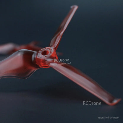 Close-up of red three-blade propeller hub with AVAN branding and blade profile detail