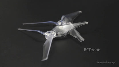 Clear EMAX Avan Flow 5x4.3x3 three-blade propeller shown at angle on dark surface