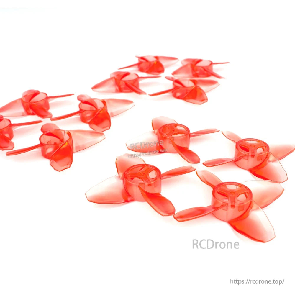 Grouped red 4-blade propellers showing side profile and hub depth on white background