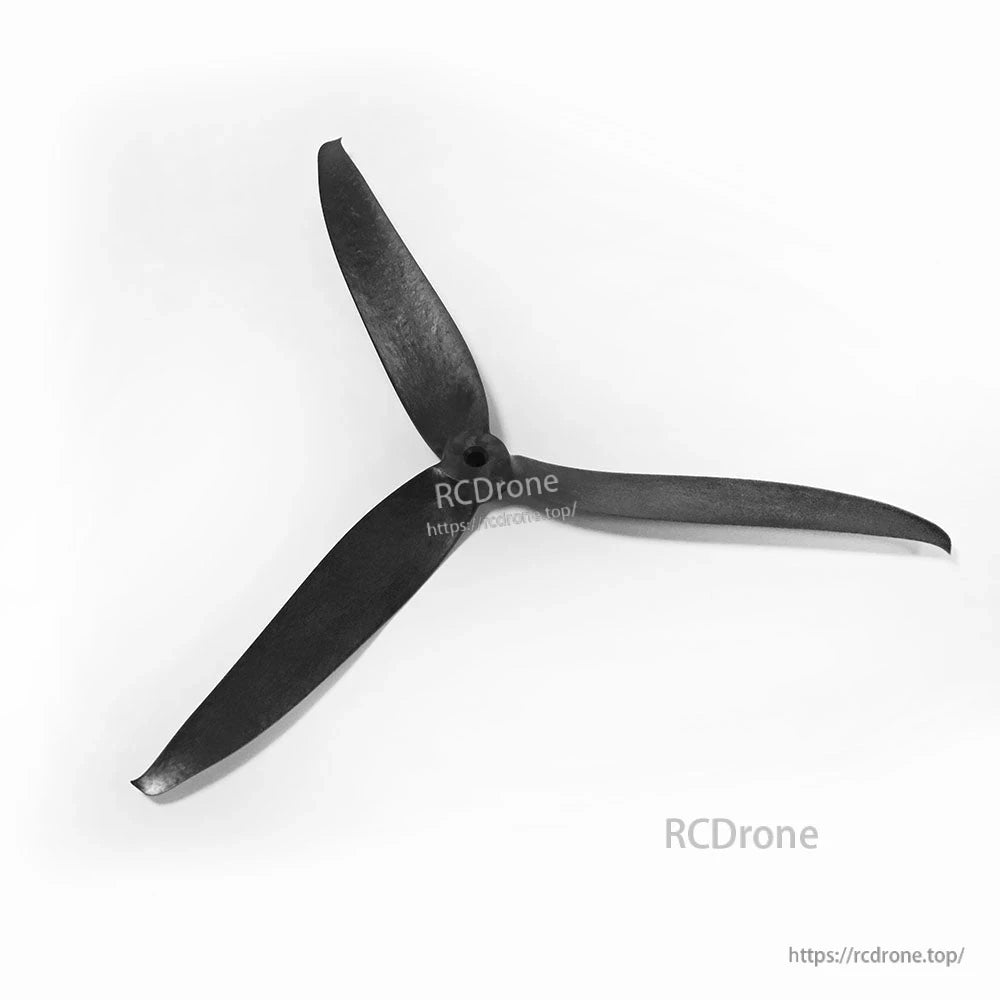 Black 3-blade drone propeller, alternate orientation with center mounting hole visible