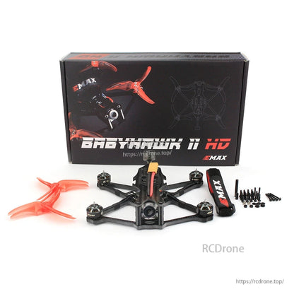 Retail box and full kit layout with quad, spare props, battery strap, and hardware set