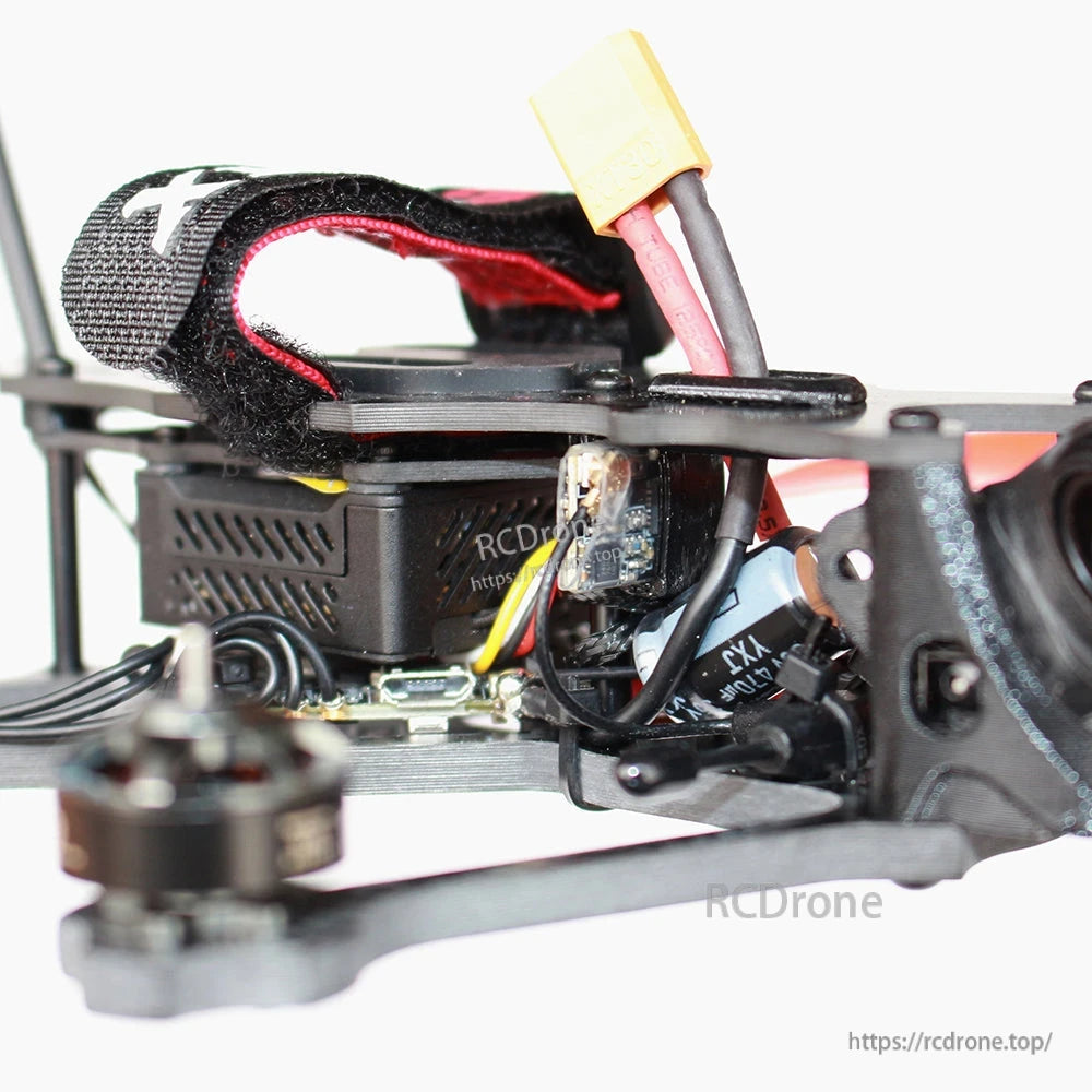 Side close-up of quad electronics stack and XT-style battery connector under top strap
