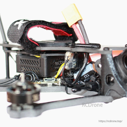 Side close-up of quad electronics stack and XT-style battery connector under top strap
